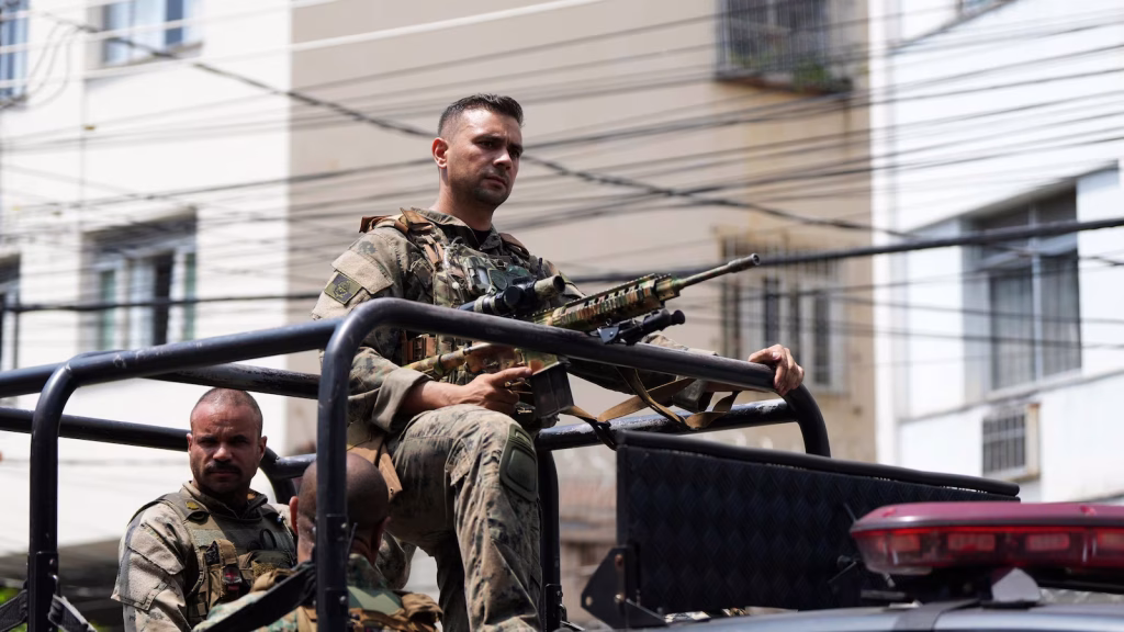 Rio police remove 4 officers from street duty as they investigate a deadly raid