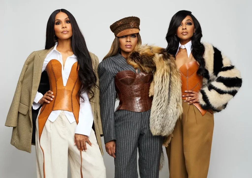 Styled by En Vogue, Jay Bolin in brown leather and tailored neutrals by Atelier Savoir