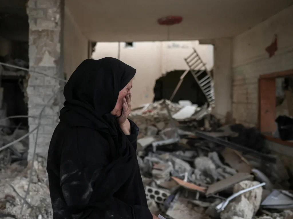 Displaced Lebanese woman returns after finding her house destroyed after ceasefire. Israel attacks Lebanon