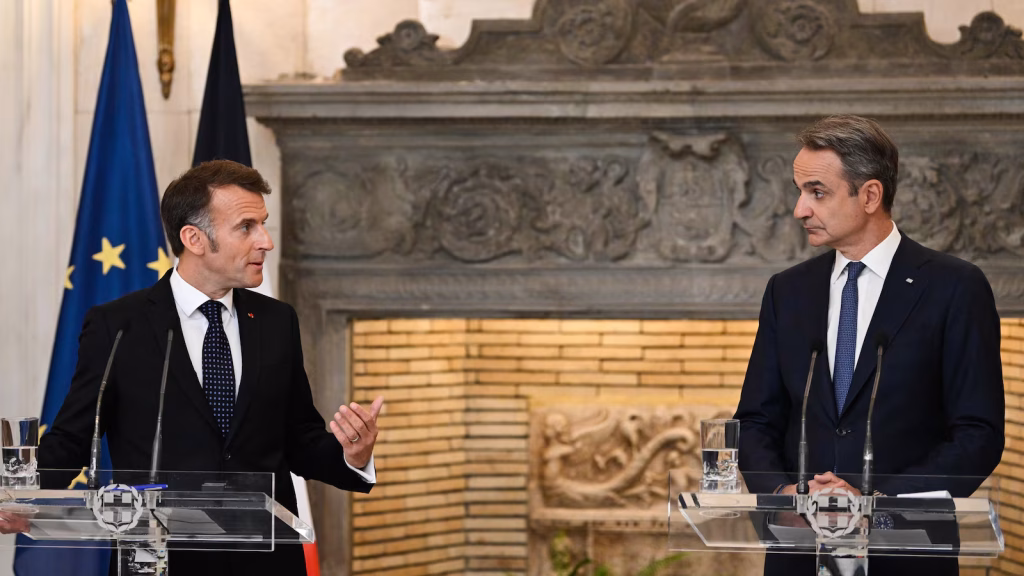Leaders of France and Greece say EU defense spending is no substitute for NATO alliance