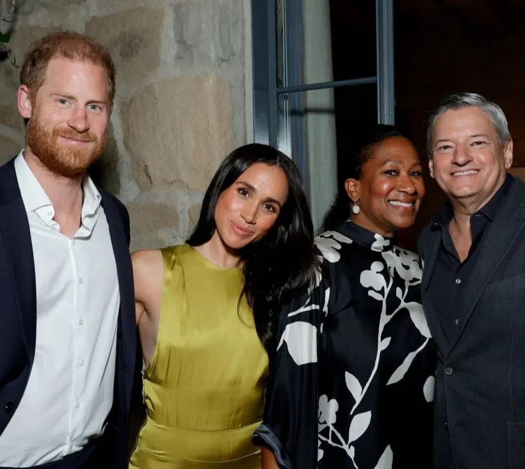 Prince Harry, Meghan Markle, Ted Sarandos and Nicole Avant gather in Montecito for a Netflix party, with Meghan in an olive green Heidi Merrick Gale dress.