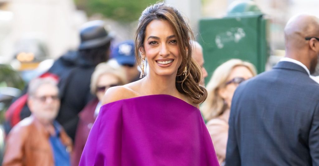 Amal Clooney swapped out white dresses for the prettiest shade of purple