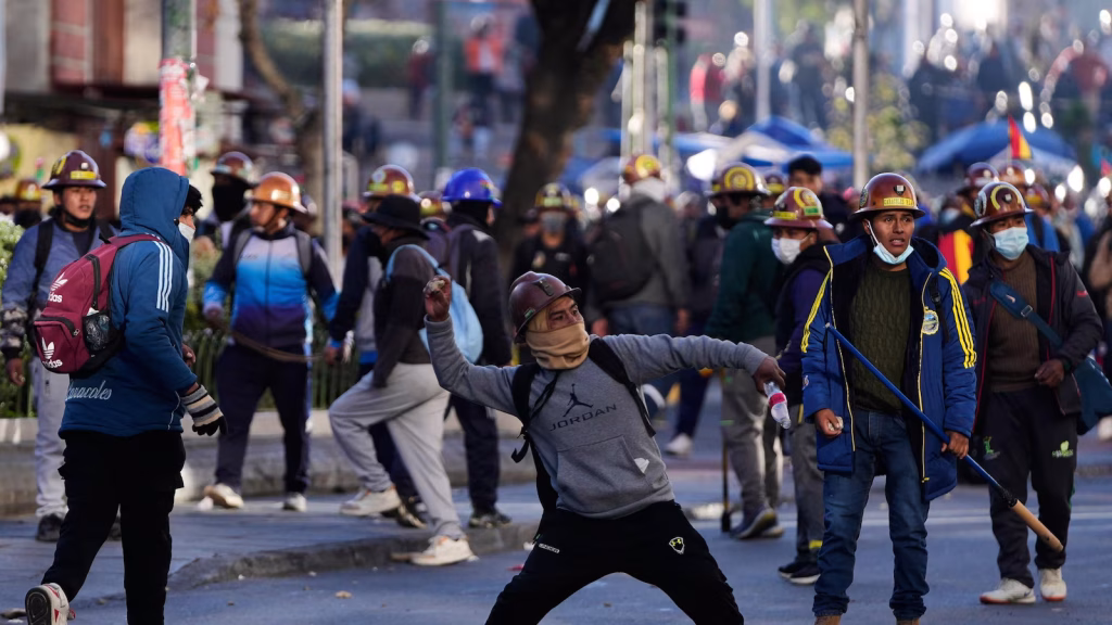 Clashes erupt in Bolivia as miners release dynamite and police fire tear gas