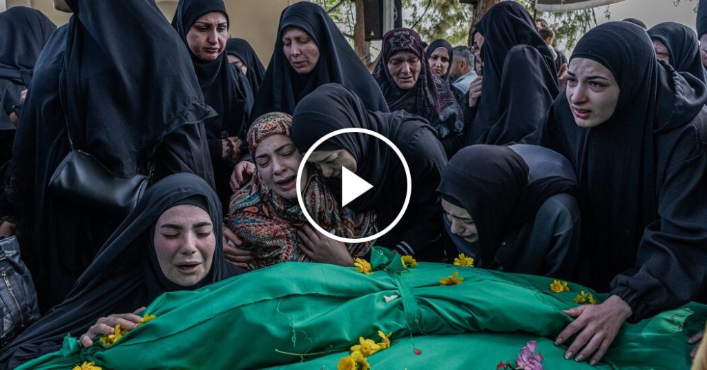 Hundreds of people mourn eight members of Lebanese family killed in Israeli attack