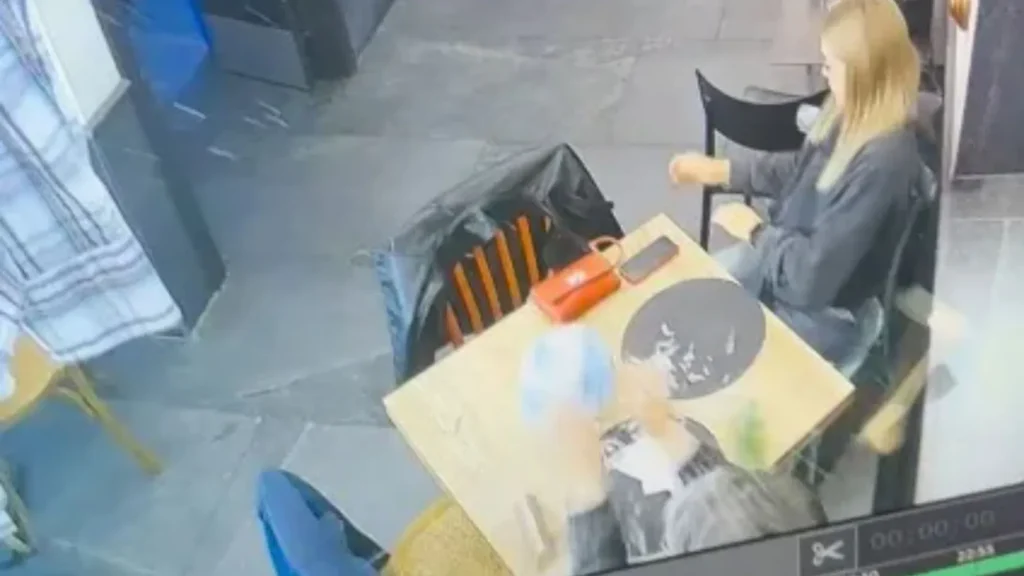 Shocking moment waiter breaks diner's glass on his face while showing football