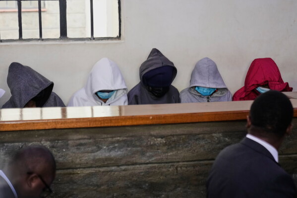 Students from Utumishi Girls Academy appear at Naivasha Law Courts in Nakuru, Kenya, Tuesday, June 2, 2026. (AP Photo/Brian Inganga)