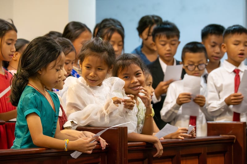 Children sing during a devotional with Elder Patrick Kearon of the Quorum of the Twelve Apostles and Sister Jennifer Kearon during his March 12-21, 2026, ministry in the Church's Asia Area.