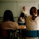 Composite image with a close-up photo of a person reading the Bible on the left and a photo of students sitting at desks in a classroom on the right.