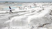 A sprawling expanse of white marble waste in Rajasthan's Kishangarh city, India, is drawing visitors to a landscape that resembles a snow-covered valley more than a dumping ground. AFP